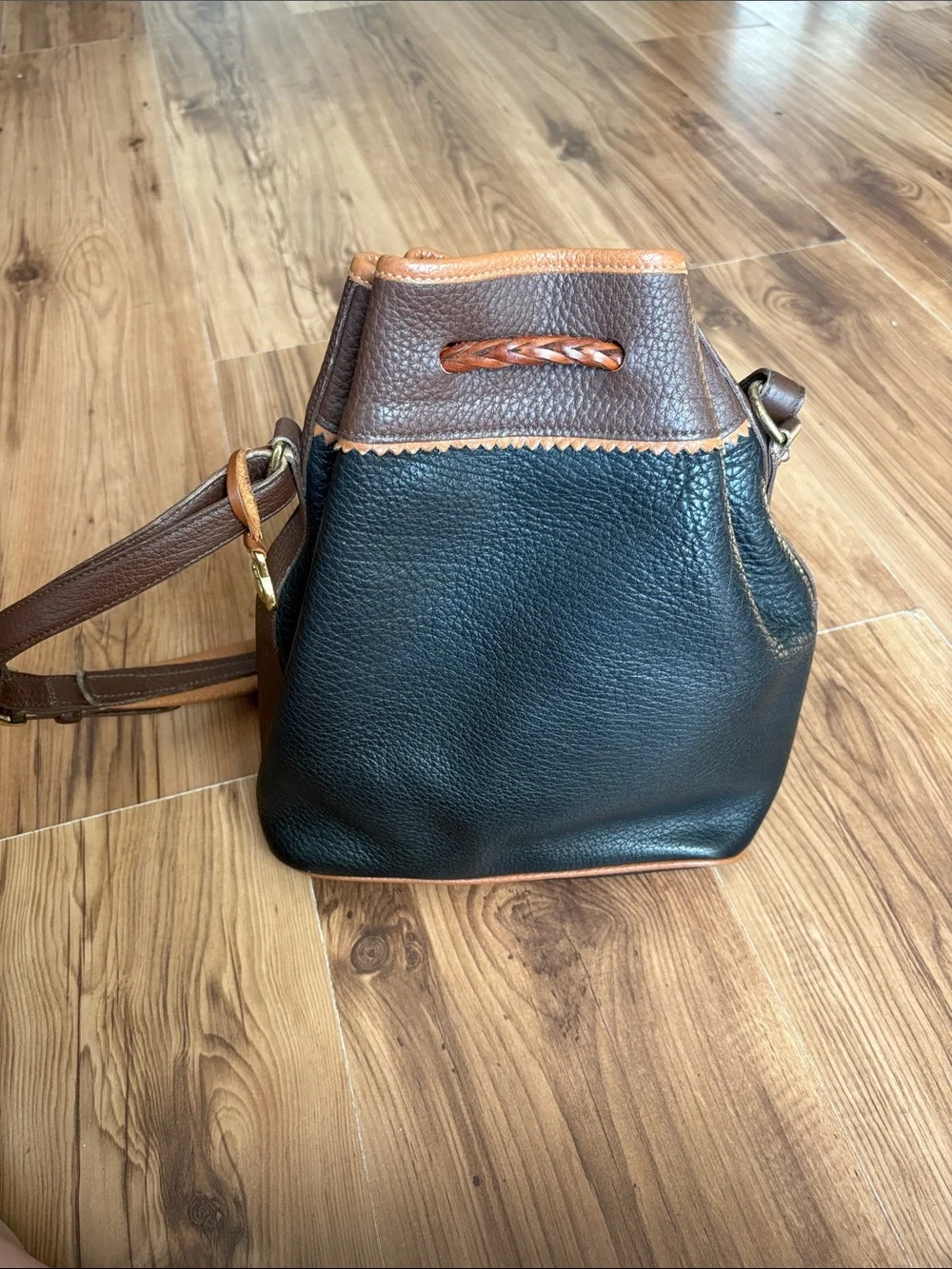 Dooney & Bourke Black with Brown Trim Leather Drawstring Bucket Bag
